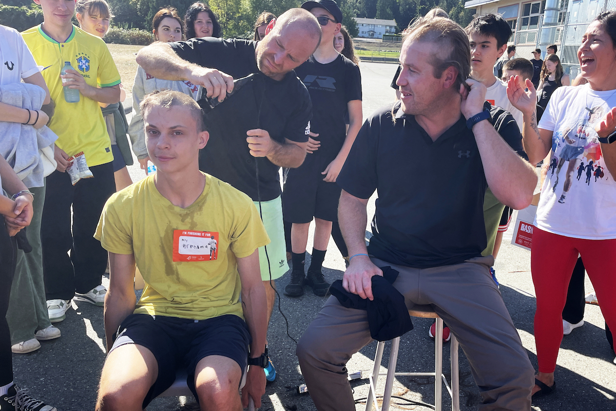 Grade 12 student Caiden Wilson and PE teacher Casey Parsons both follow through on their fundraising pledges to shave their heads during Chemainus Secondary’s Terry Fox Run event.